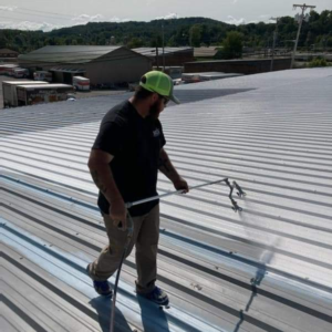 spartan roof coating clarksville service A man performing industrial roofing services in Clarksville, TN