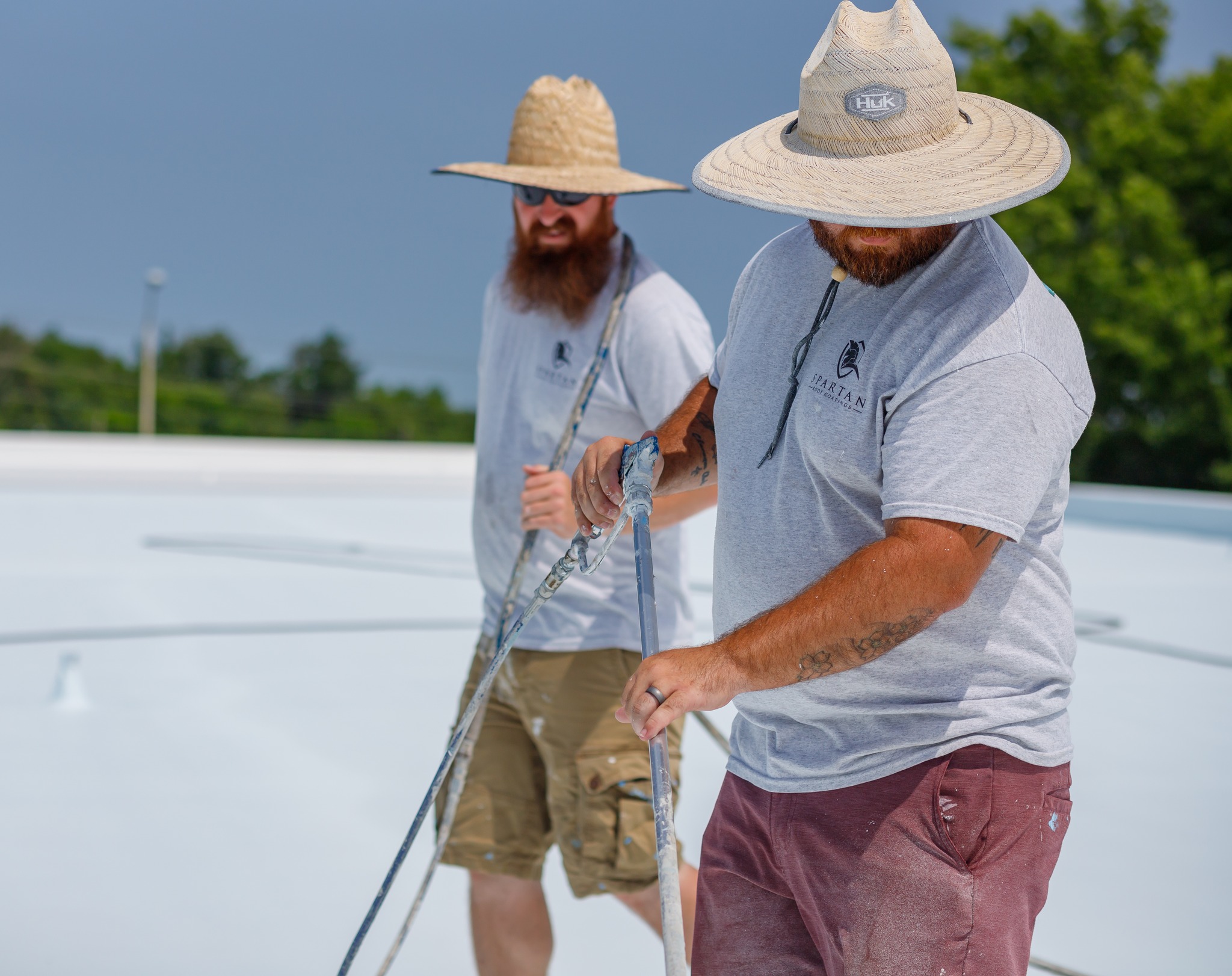 Two men together on a roof