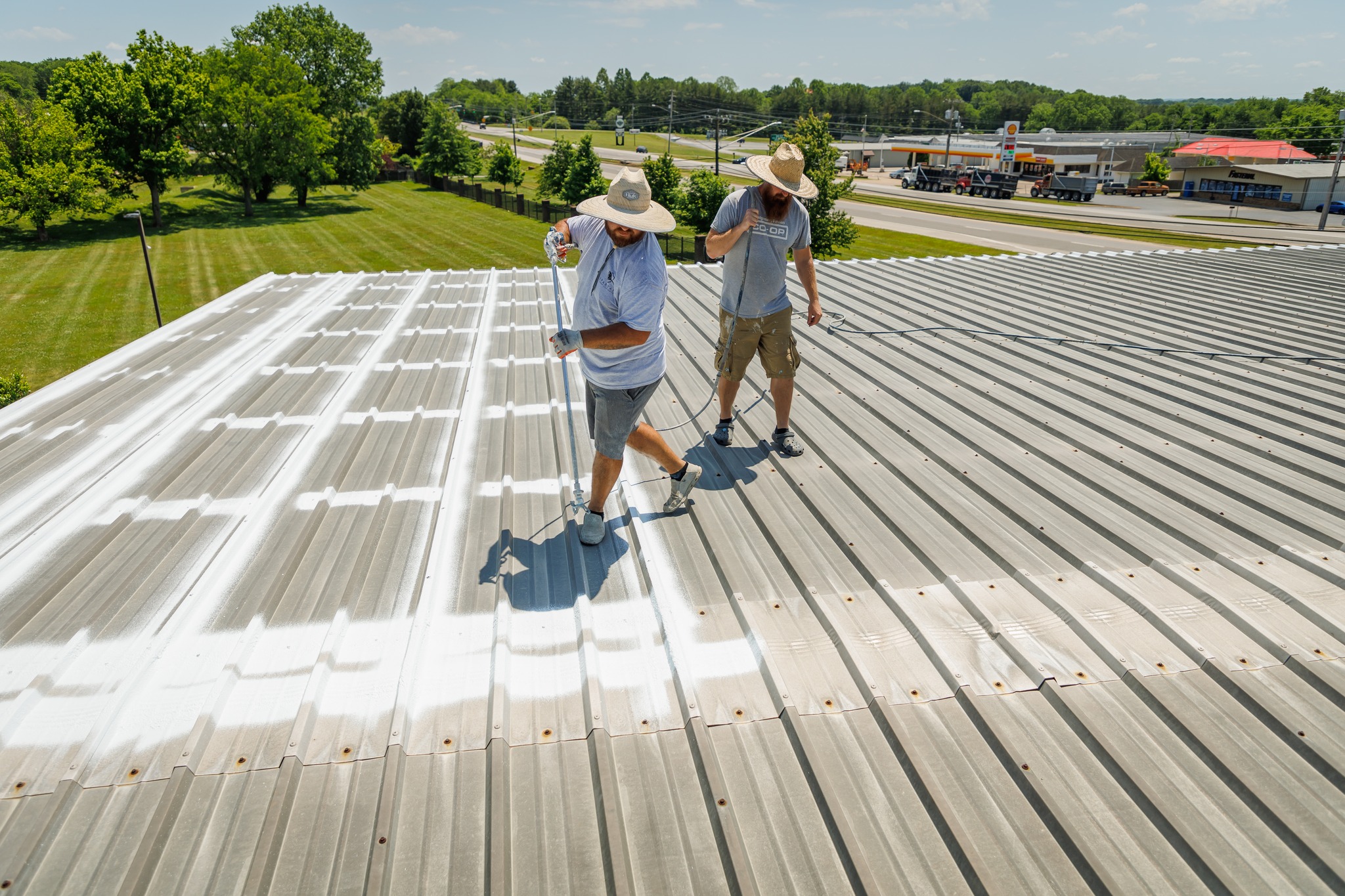 Men spraying roof